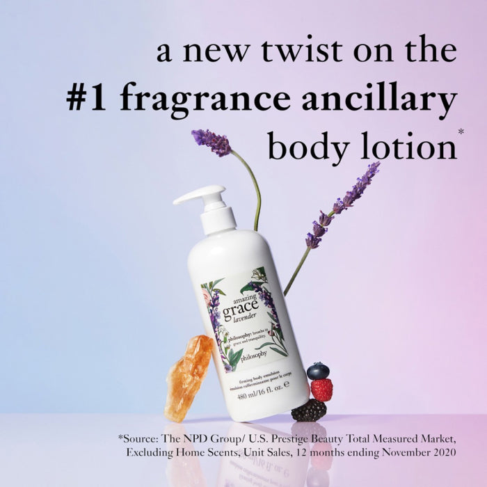 Philosophy lavender firming body lotion bottle with lavender flowers and natural crystal on purple and blue background