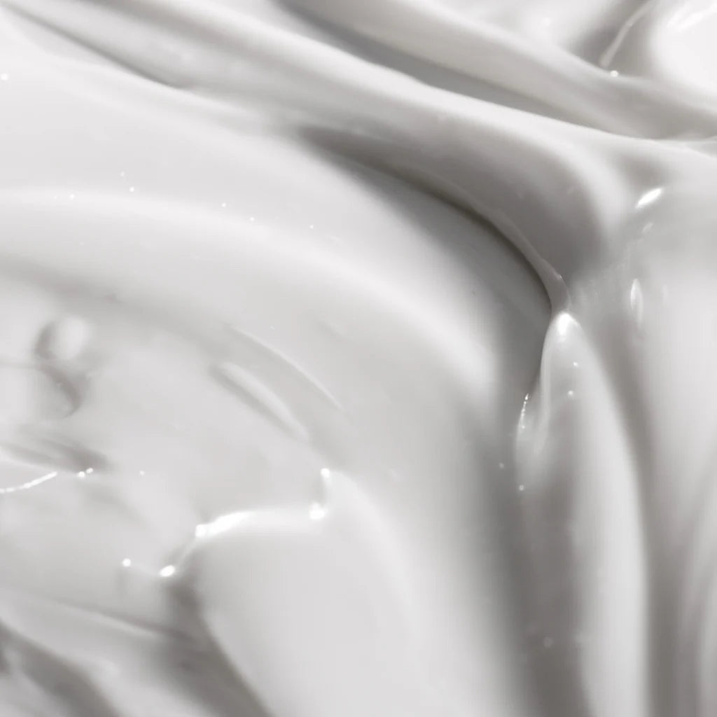 Close-up of smooth creamy texture of lavender firming body lotion from Philosophy