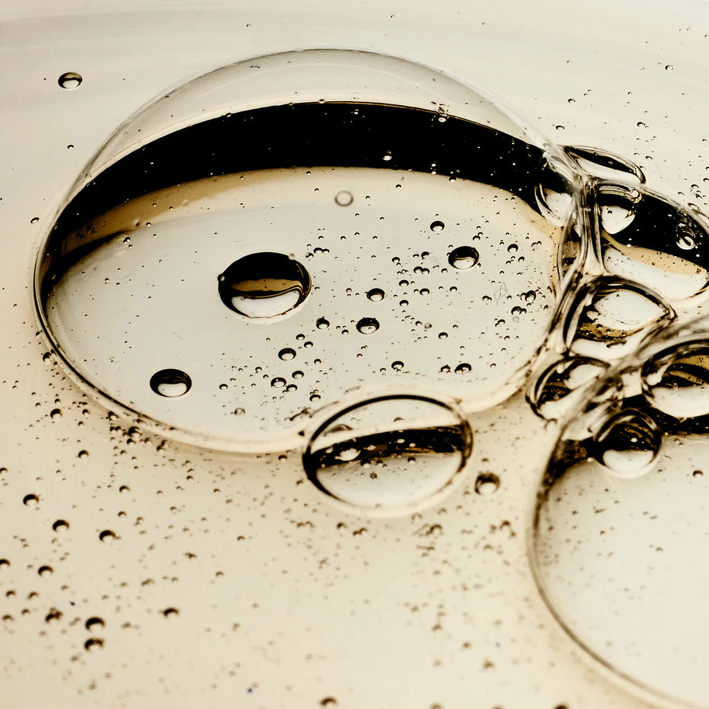 Close up of transparent gel bubbles representing Philosophy facial firming serum texture