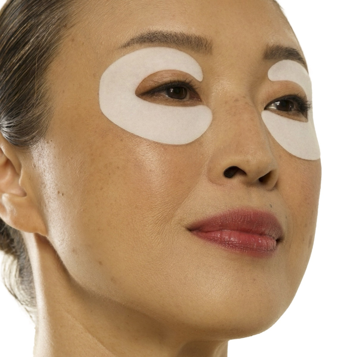 All Golden 360 degree under eye lifting pads applied on woman’s face for brightening and lifting