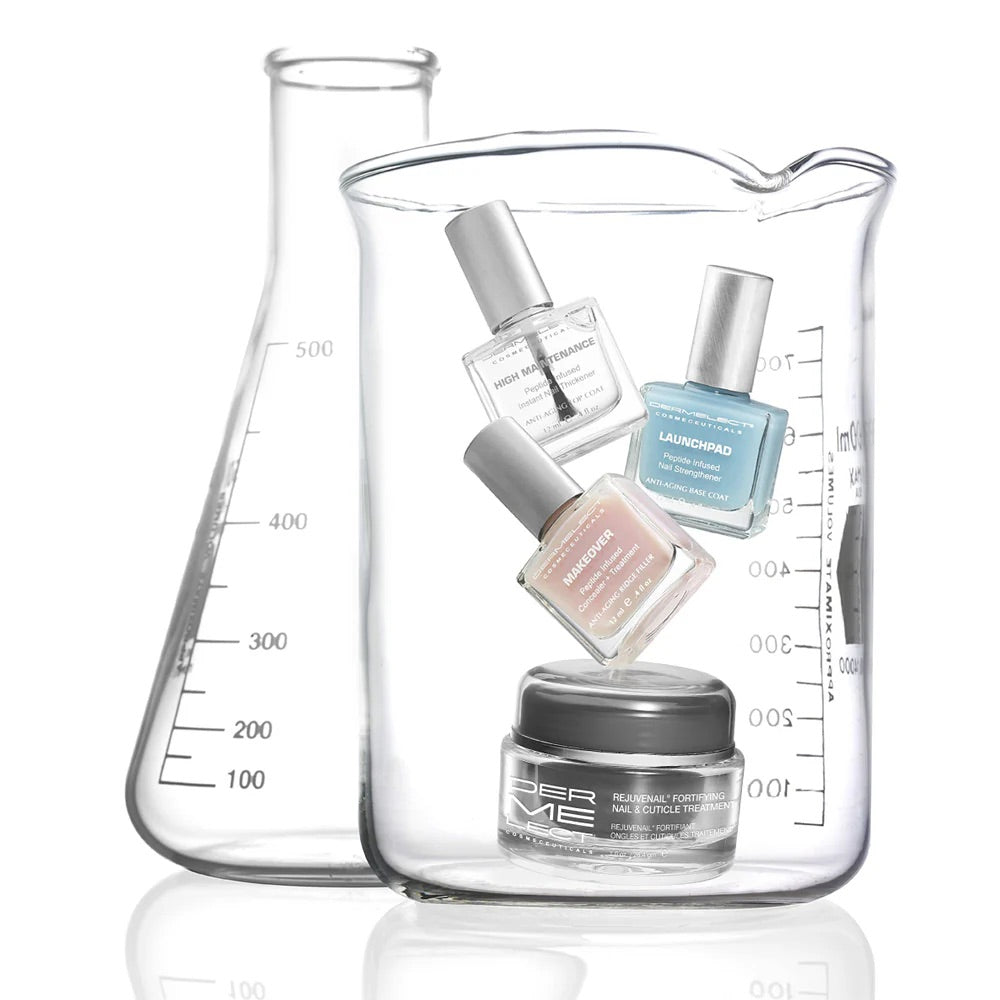Dermelect nail recovery kit showing three polish bottles and a treatment jar displayed inside glass beakers
