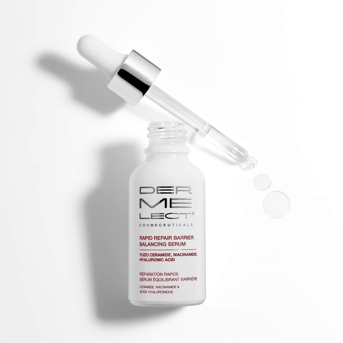Dermelect Rapid Repair Serum white dropper bottle with pipette and clear serum drops on a white background