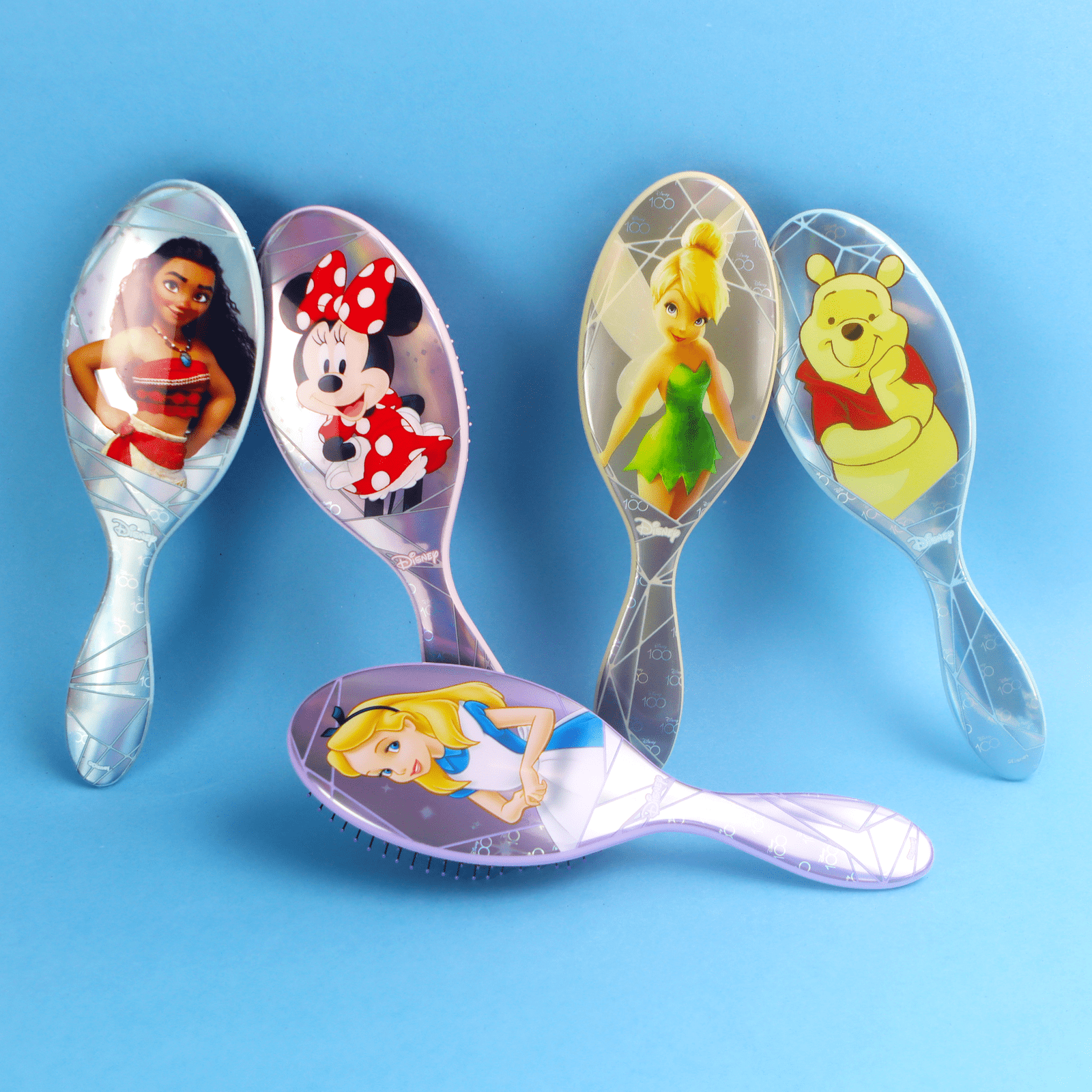 Disney 100 wet brush set featuring Moana, Minnie Mouse, Tinkerbell, Winnie the Pooh, and Alice in Wonderland designs