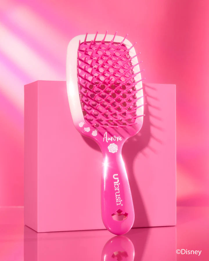 Unbrush Disney Princess detangling hair brush in pink with a floral design and a comfortable grip
