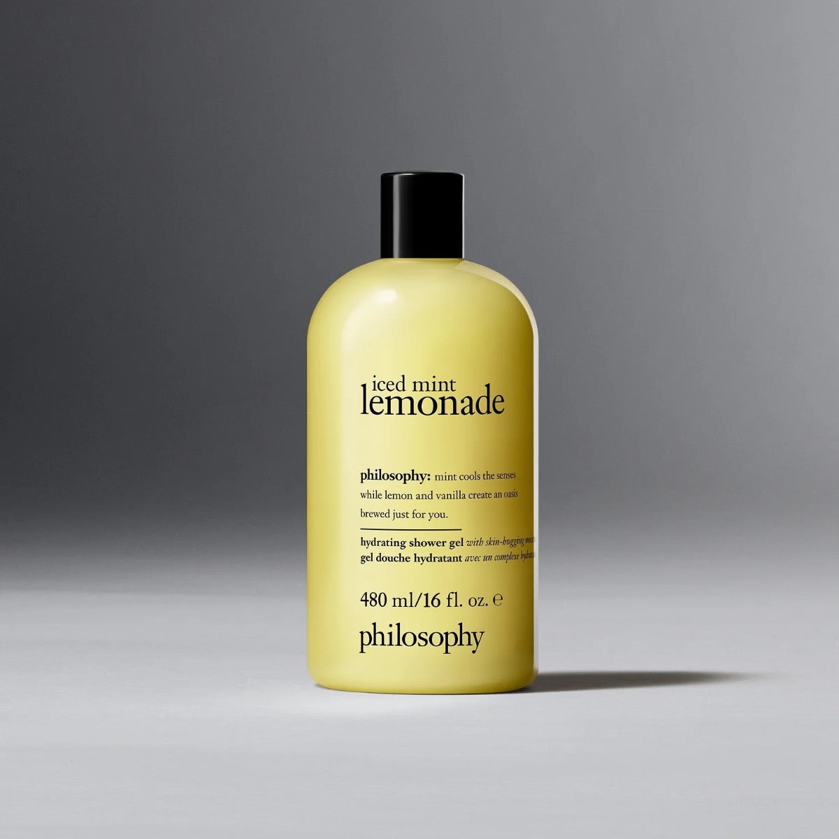 Philosophy iced mint lemonade shower gel in yellow 16 oz bottle with black cap on gray background
