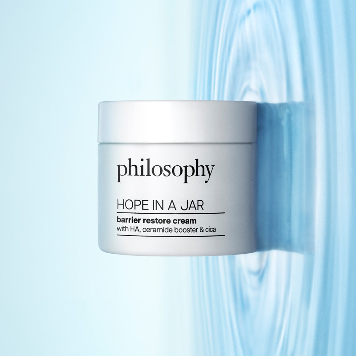 Philosophy Hope In A Jar cream white jar of barrier restore moisturizer on blue rippled water background