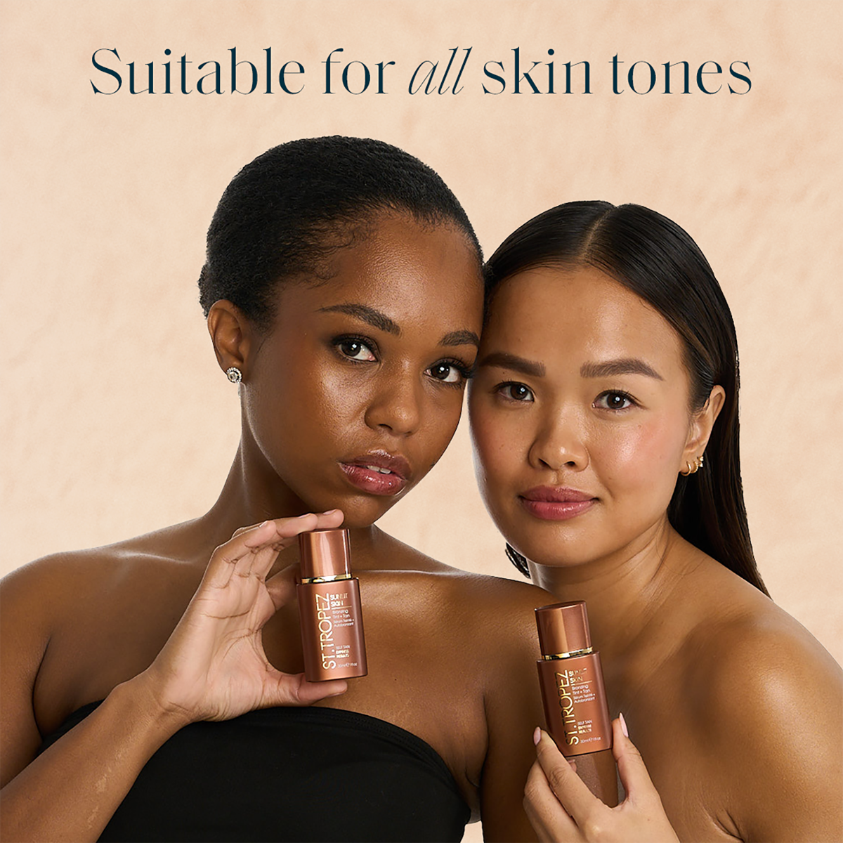 Two women with different skin tones holding St Tropez bronzing tint bottles suitable for all skin tones