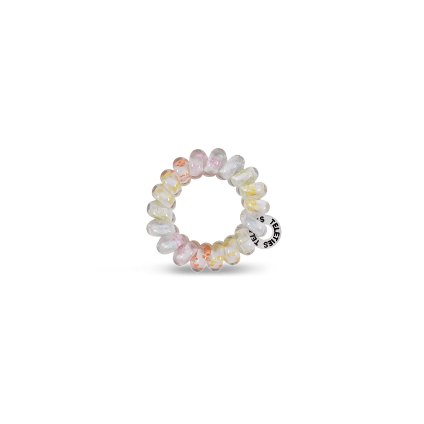 Teleties tiny hair ties in pastel colors, perfect for holding hair without damage