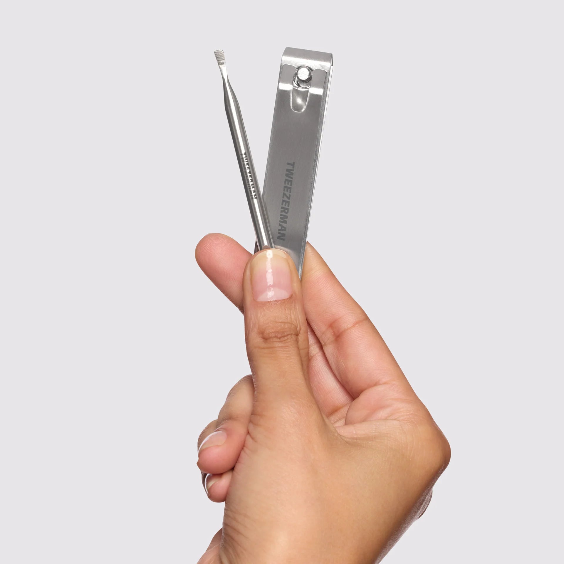 Tweezerman nail care set featuring a nail clipper and precision tool, ideal products for nail care.