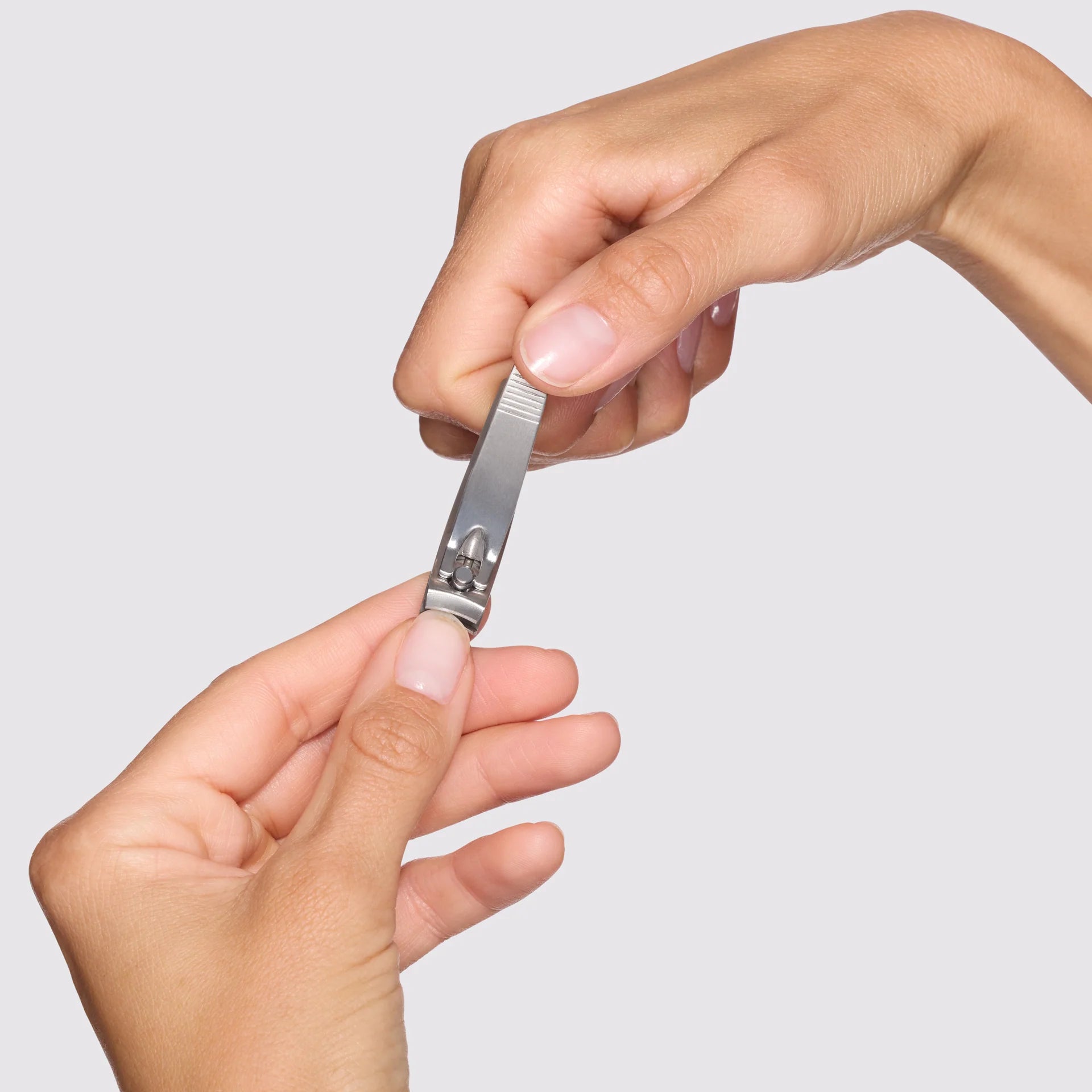 Tweezerman Nail Clipper in use for precise nail trimming, ideal products for nail care