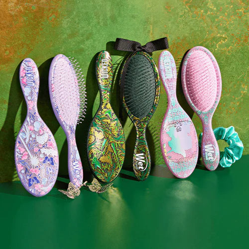Wet Brush detangle and style kit featuring six colorful, patterned brushes and a hair scrunchie