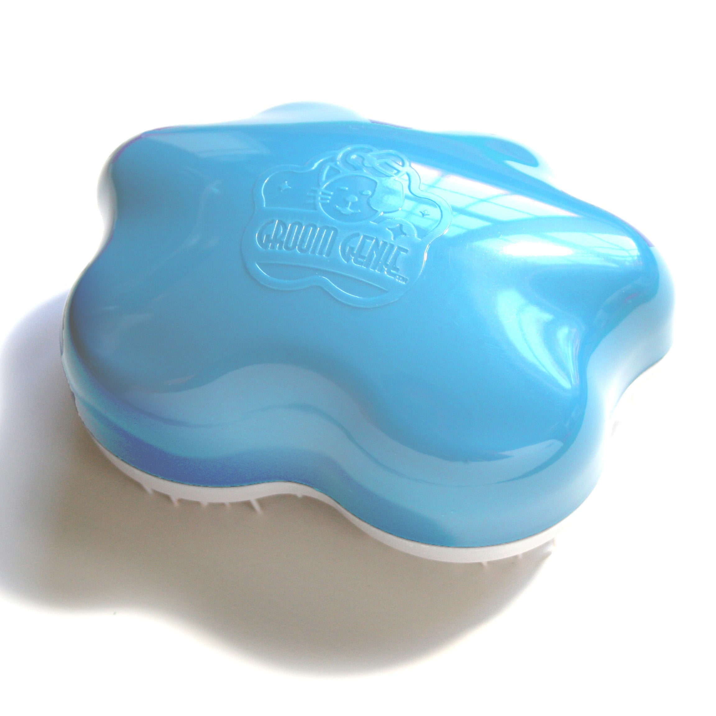 Knot Genie blue pet detangling brush with ergonomic design for easy grooming