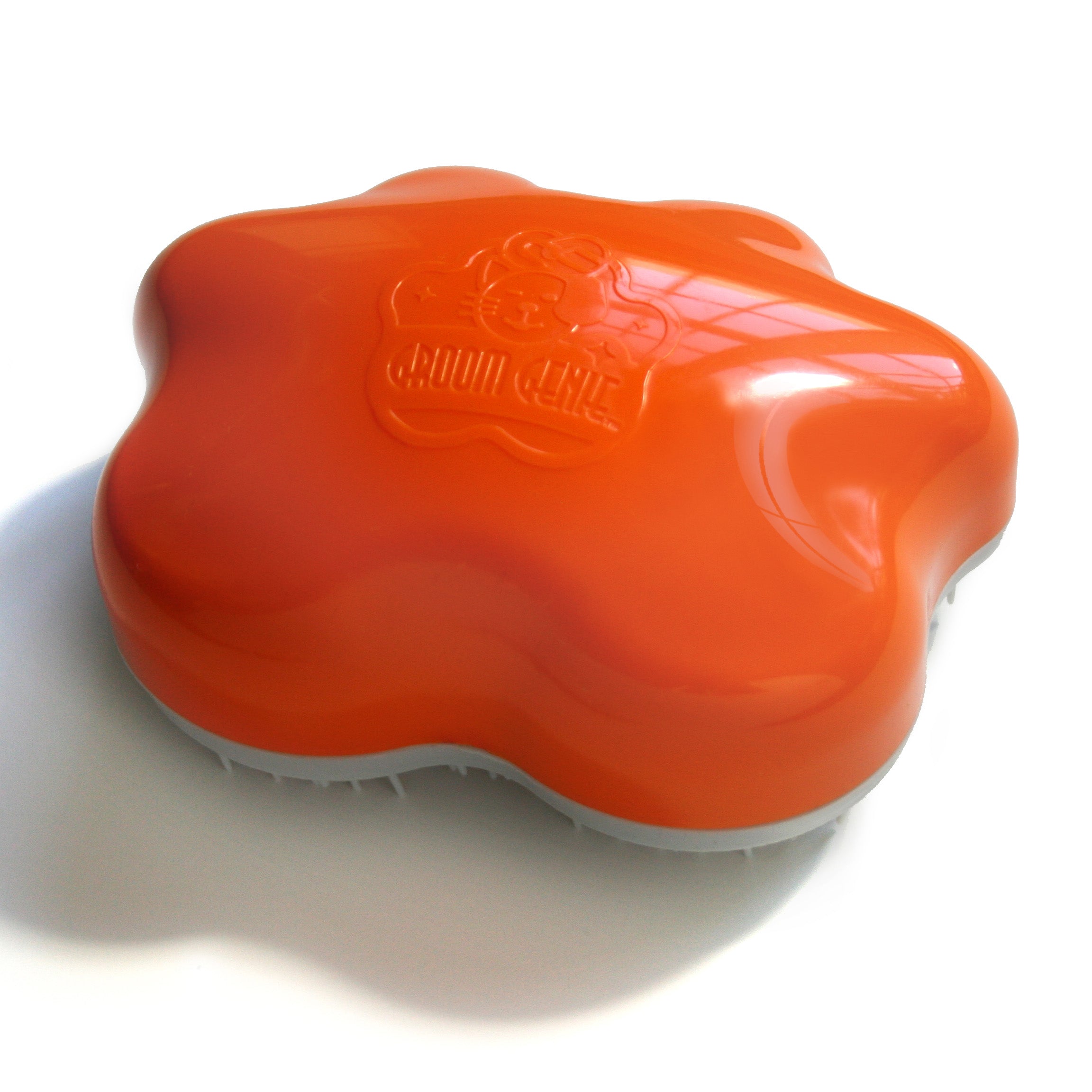Orange Groom Genie Teeny pet brush with ergonomic design for gentle pet grooming