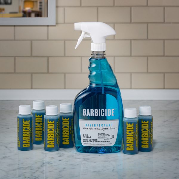 Barbicide Bullets disinfectant bottles with a large spray bottle for surface cleaning and sanitizing