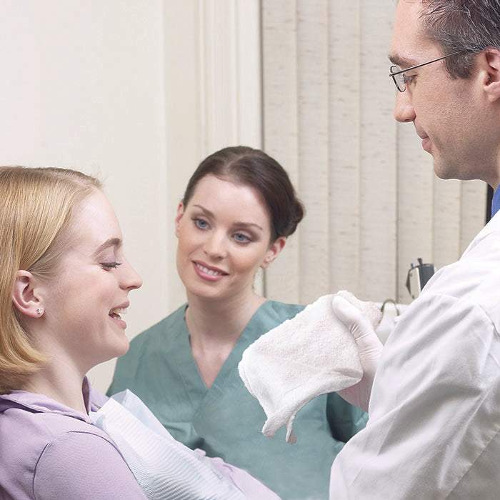 Cotton refreshment towels provided by White Towel Services for patient comfort during dental visits