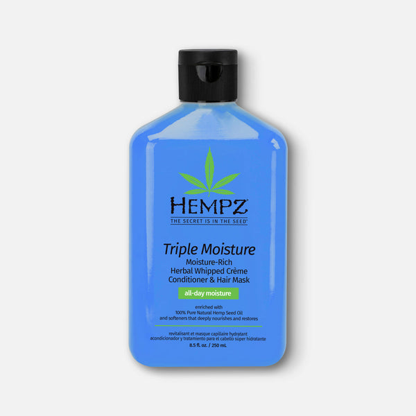 Hempz conditioner for damaged hair in a blue bottle with herbal ingredients for deep hydration