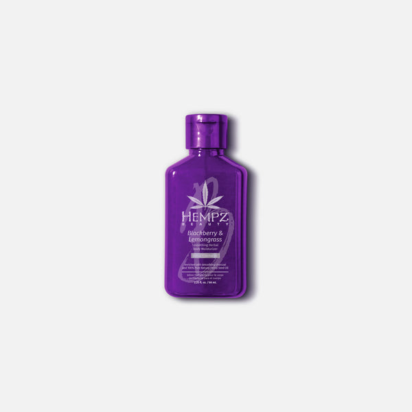 Hempz travel size moisturizer in a purple bottle with blueberry and lemongrass scent