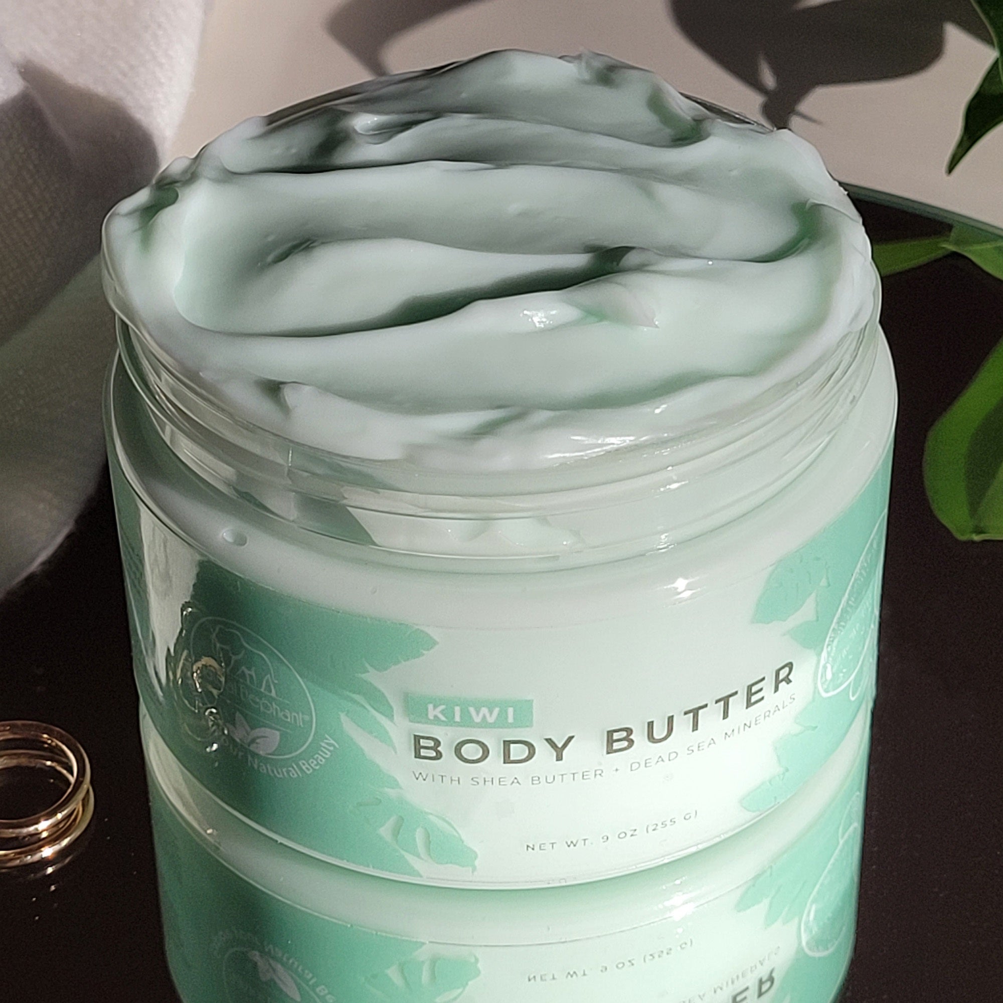 Dead Sea Shea Body Butter in a jar with a mint green texture, perfect for moisturizing skin