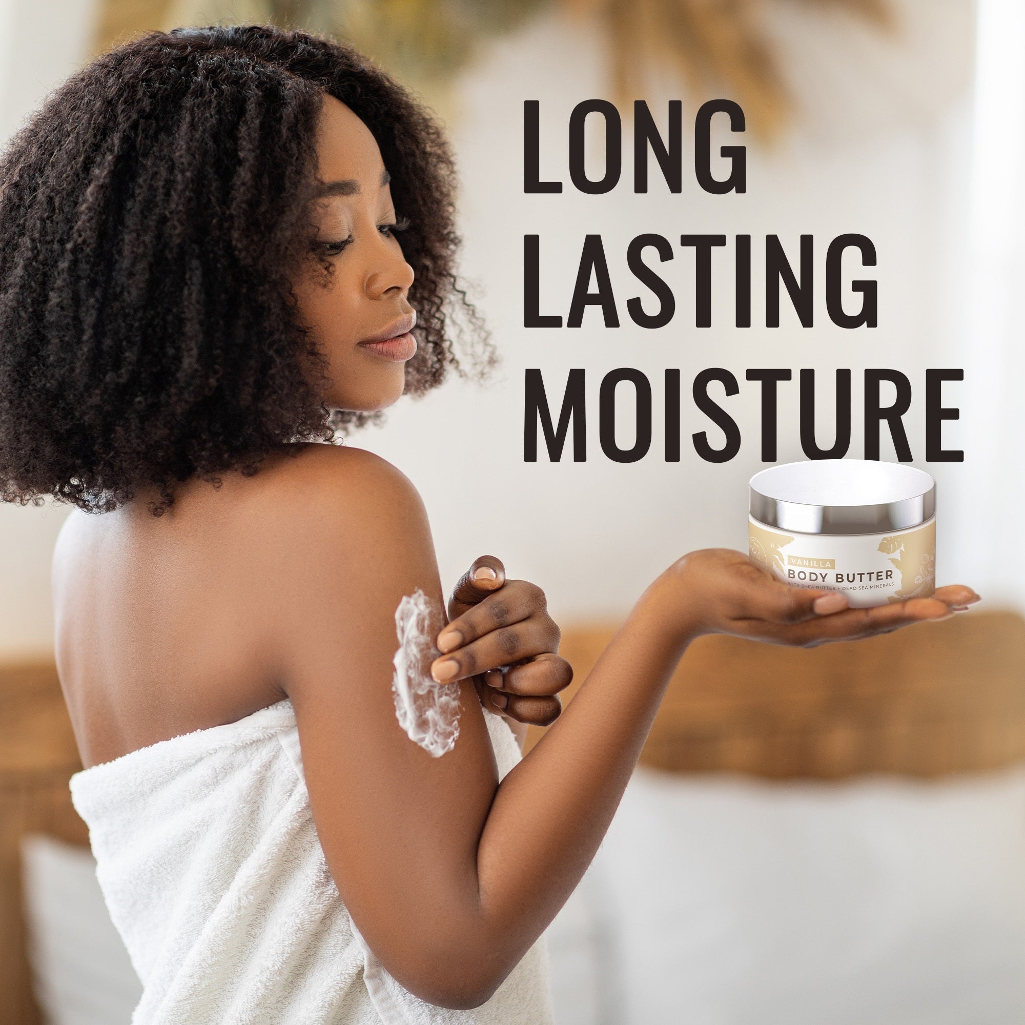 Model applying Dead Sea Shea Body Butter for long lasting moisture on her skin