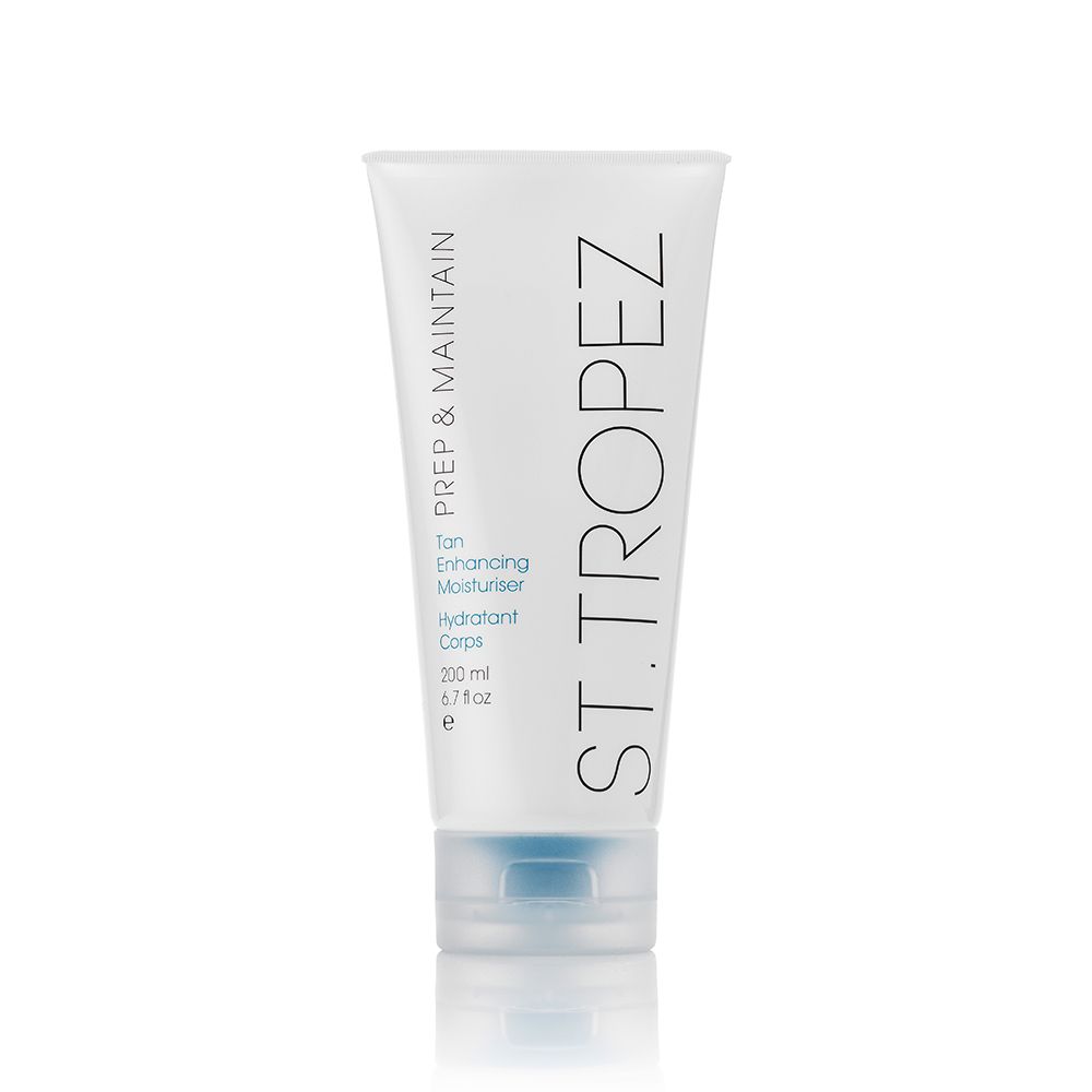 St Tropez tan enhancing body moisturizer in white tube with blue cap for hydrated skin