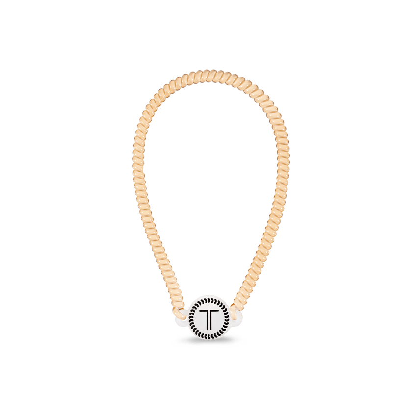 Teleties headband in beige with a stylish T logo for comfortable and secure hair management