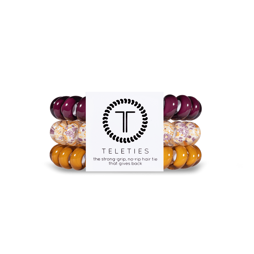 Teleties strong grip hair ties in purple and yellow hues for a secure and stylish hold
