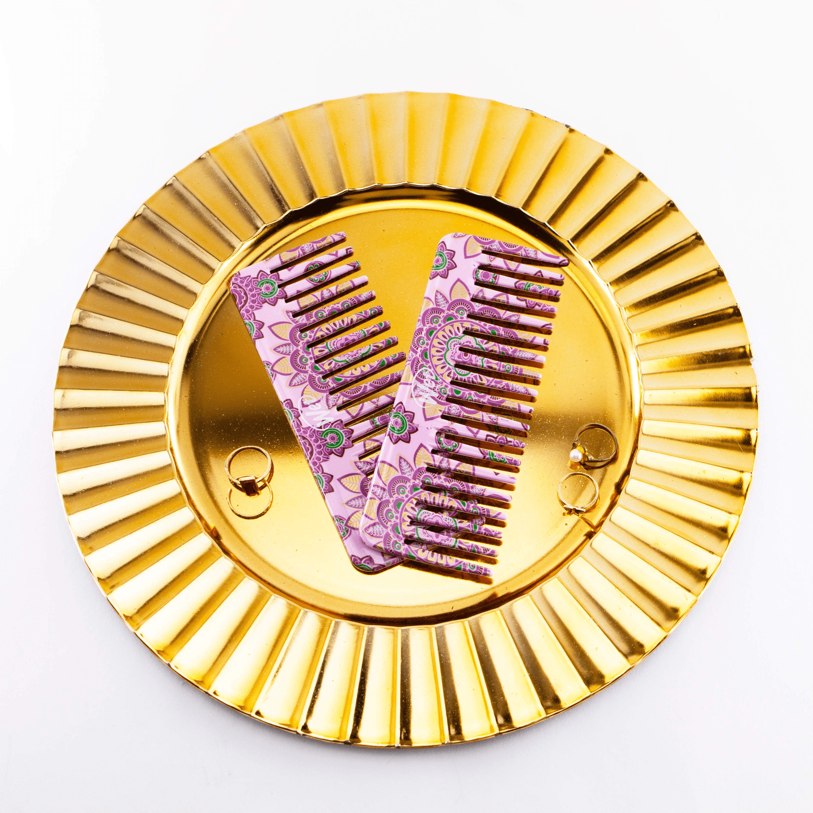 Wet Brush Moroccan print detangler comb in purple with intricate floral design on gold plate
