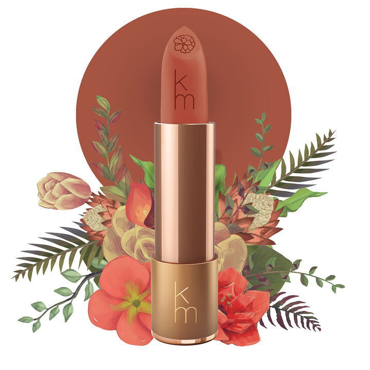 Karen Murrell natural lipstick terracotta shade in gold tube with floral background and branded logo