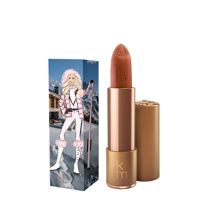 Karen Murrell natural lipstick nude brown in gold tube with embossed km and illustrated winter ski packaging