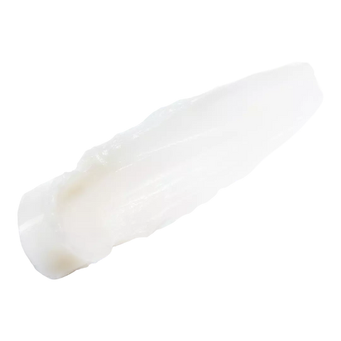 Close-up of creamy texture of philosophy lip serum on black background