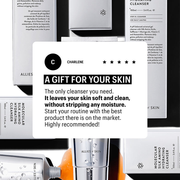 Flat lay of white Allies of Skin hydrating cleanser packaging and tube with product review card