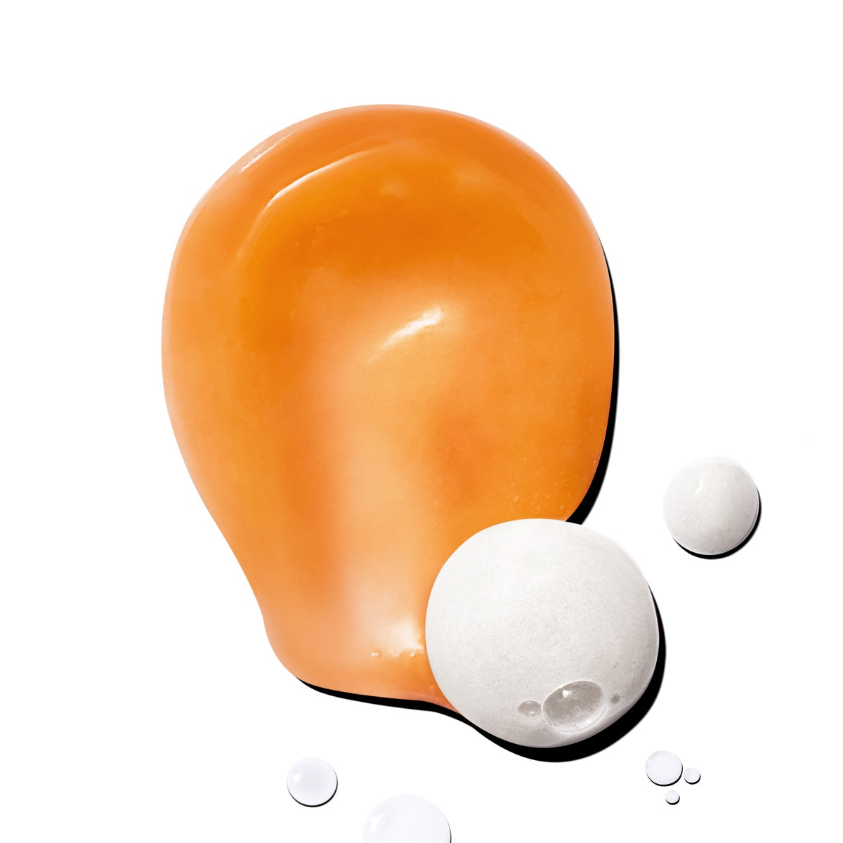Allies of Skin hydrating cleanser orange gel swatch with white foam beads on white background