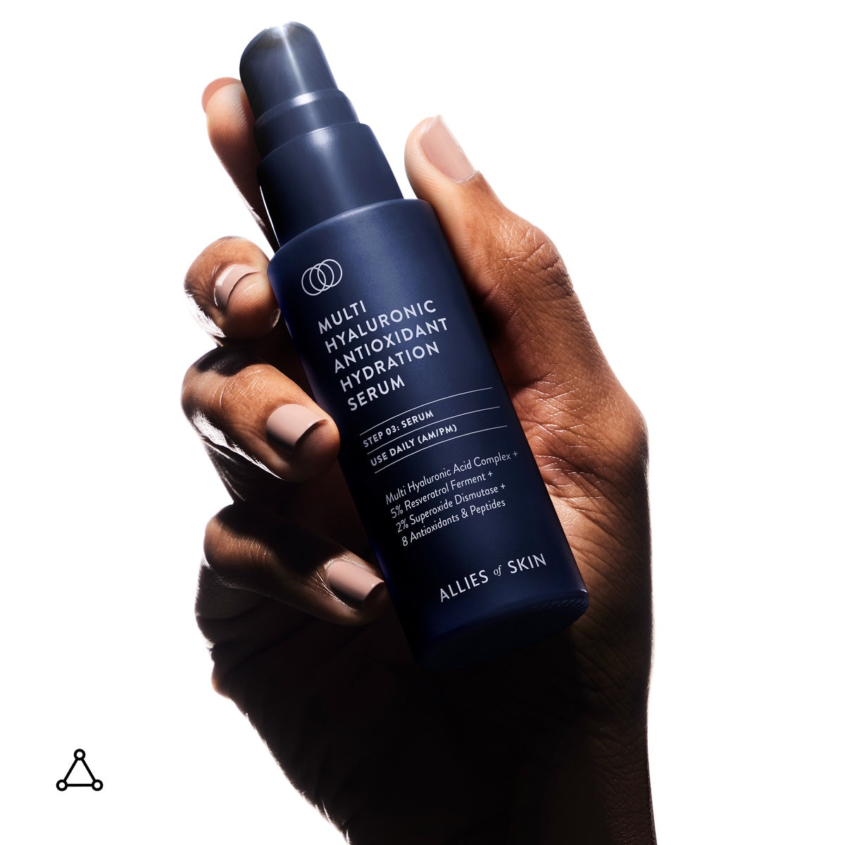 Hand holding Allies of Skin navy pump bottle Multi Hyaluronic Antioxidant hyaluronic acid hydration serum