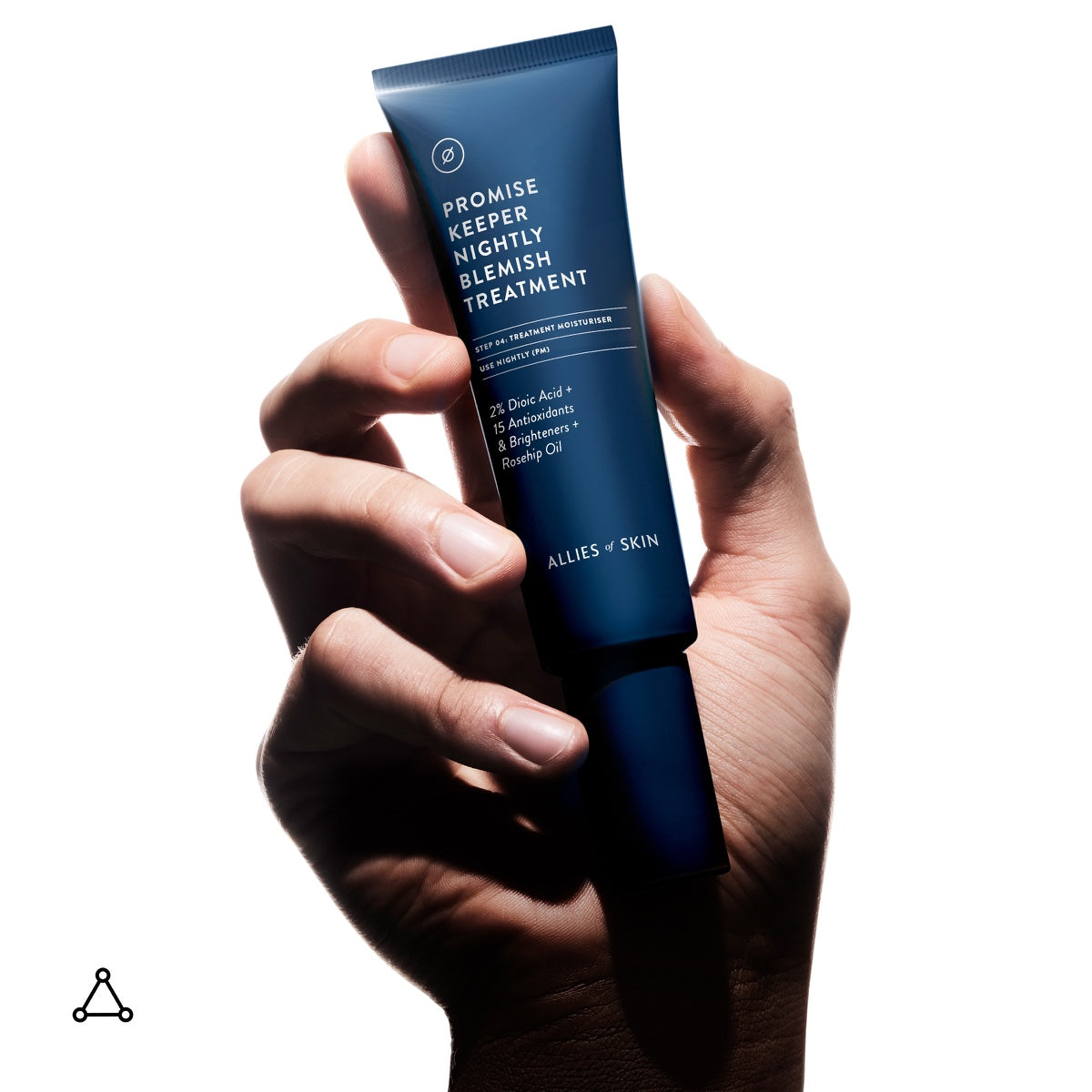 Hand holding Allies of Skin Promise Keeper tube nightly blemish treatment for acne prone skin