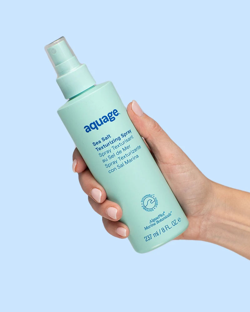 Aquage Sea Salt Texturizing Spray in a light blue bottle for creating beachy waves and volume