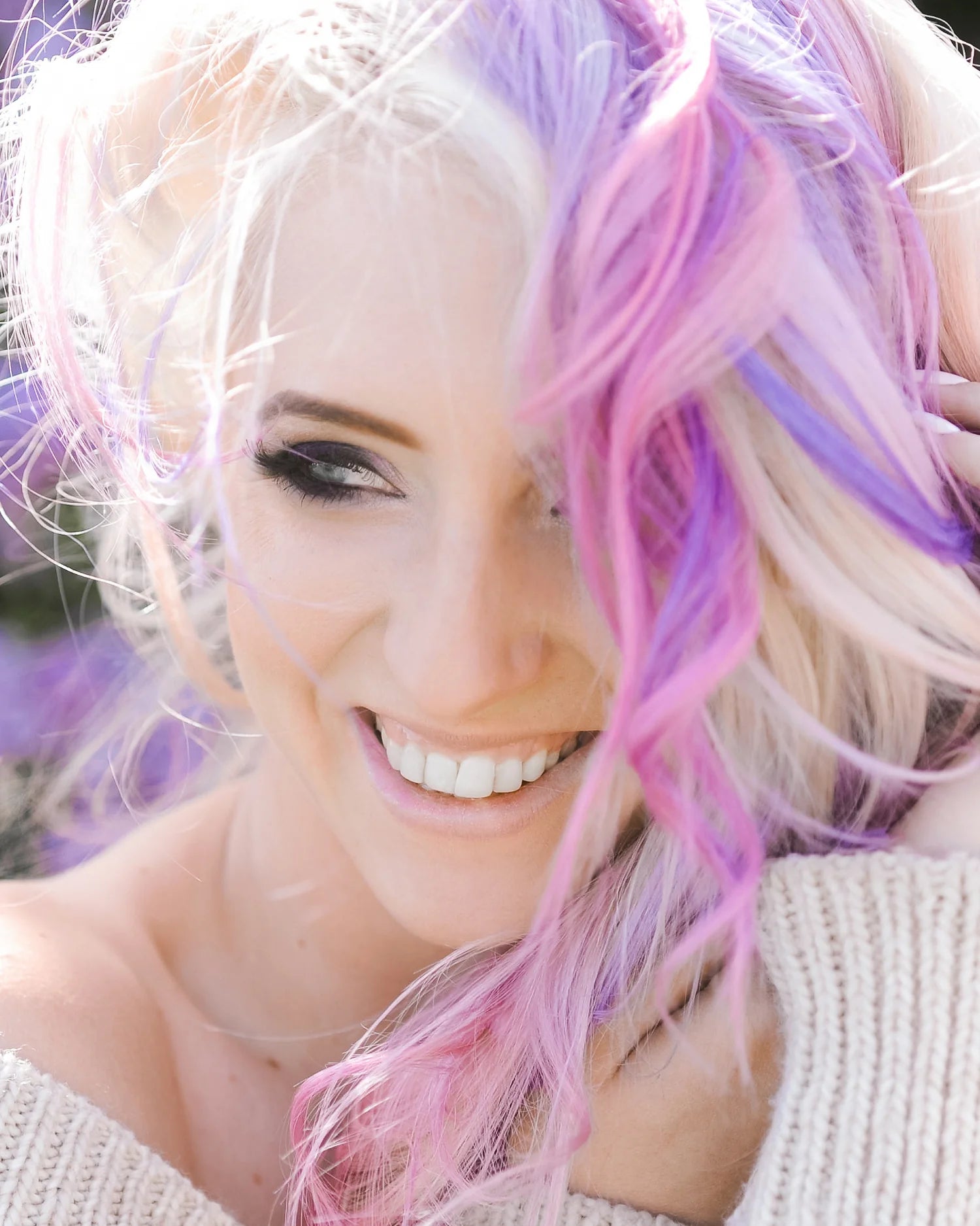 One 'N Only semi-permanent hair color remover in use on a woman with pastel hair colors