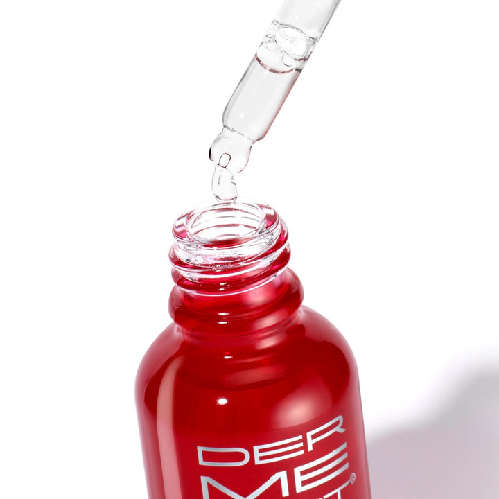Dermelect Self-Esteem Beauty Sleep Serum red glass bottle with dropper releasing clear serum for nightly anti aging skincare