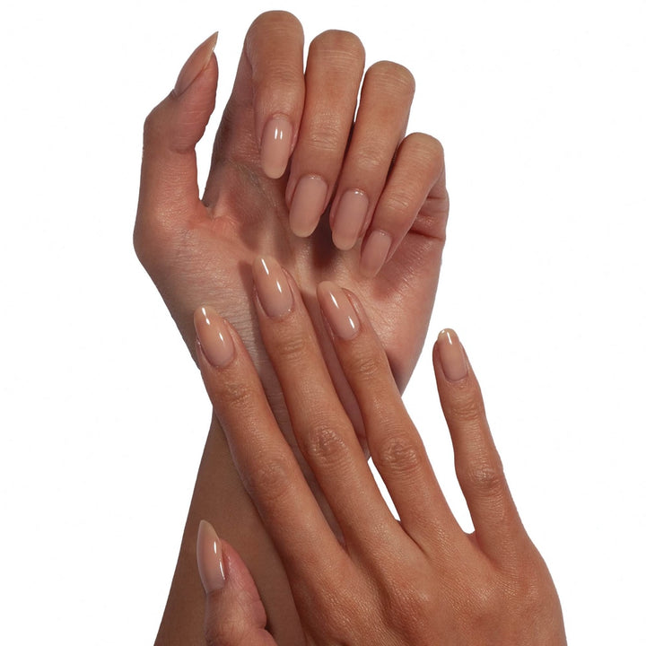 Two hands with almond shaped nude glossy nails wearing Dermelect Transfix base coat for smooth salon finish