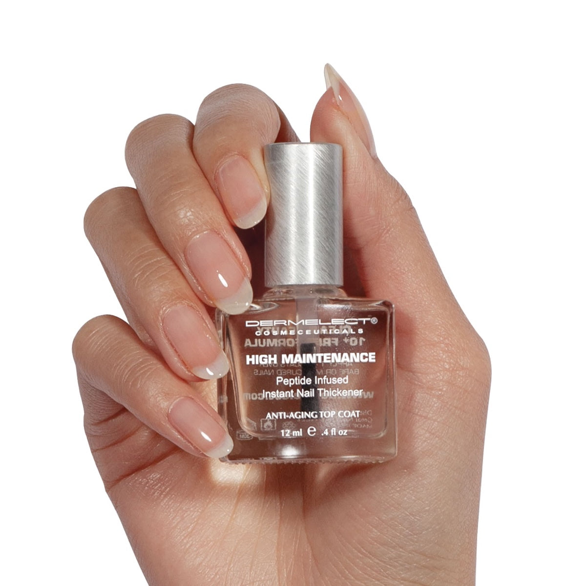 Dermelect High Maintenance bottle held in hand clear peptide infused nail thickener top coat for stronger glossy nails