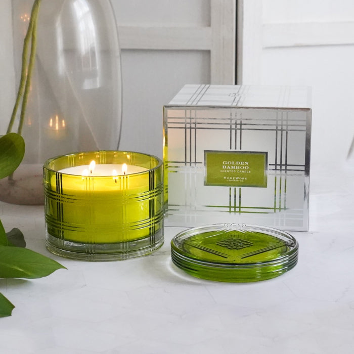 HomeWorx by Slatkin golden bamboo scented candle in green glass with matching lid and decorative packaging