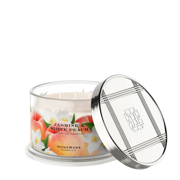 HomeWorx by Slatkin jasmine and white peach candle in glass jar with silver lid and floral design