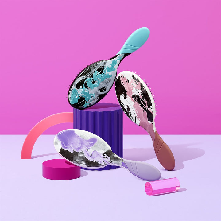 Wet Brush Inked Impressions tattoo style hair brush set with colorful abstract designs on handles