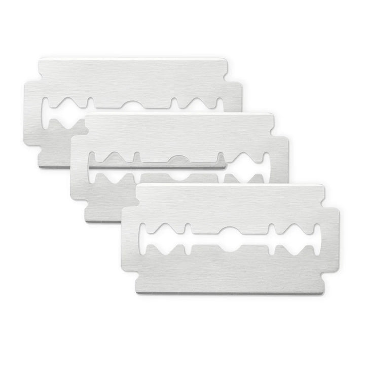 Three stainless steel double edge Jaguar R1 razor blades stacked showing sharp edges for precise shaving