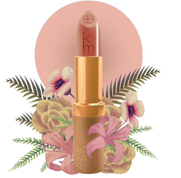Karen Murrell natural lip tint peach nude lipstick in gold case embossed km with floral leaves backdrop