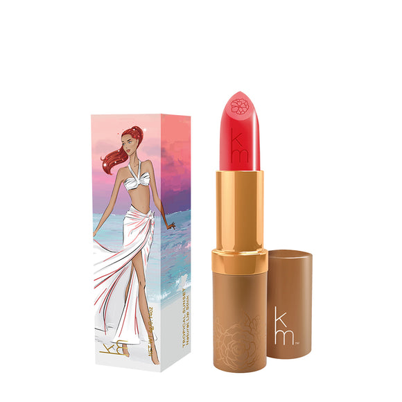 Karen Murrell natural lip tint coral pink lipstick tube with gold trim and illustrated beach packaging