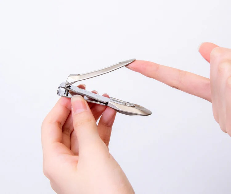 Seki Edge nail clipper for dogs held in hand, designed for precise grooming with ergonomic grip