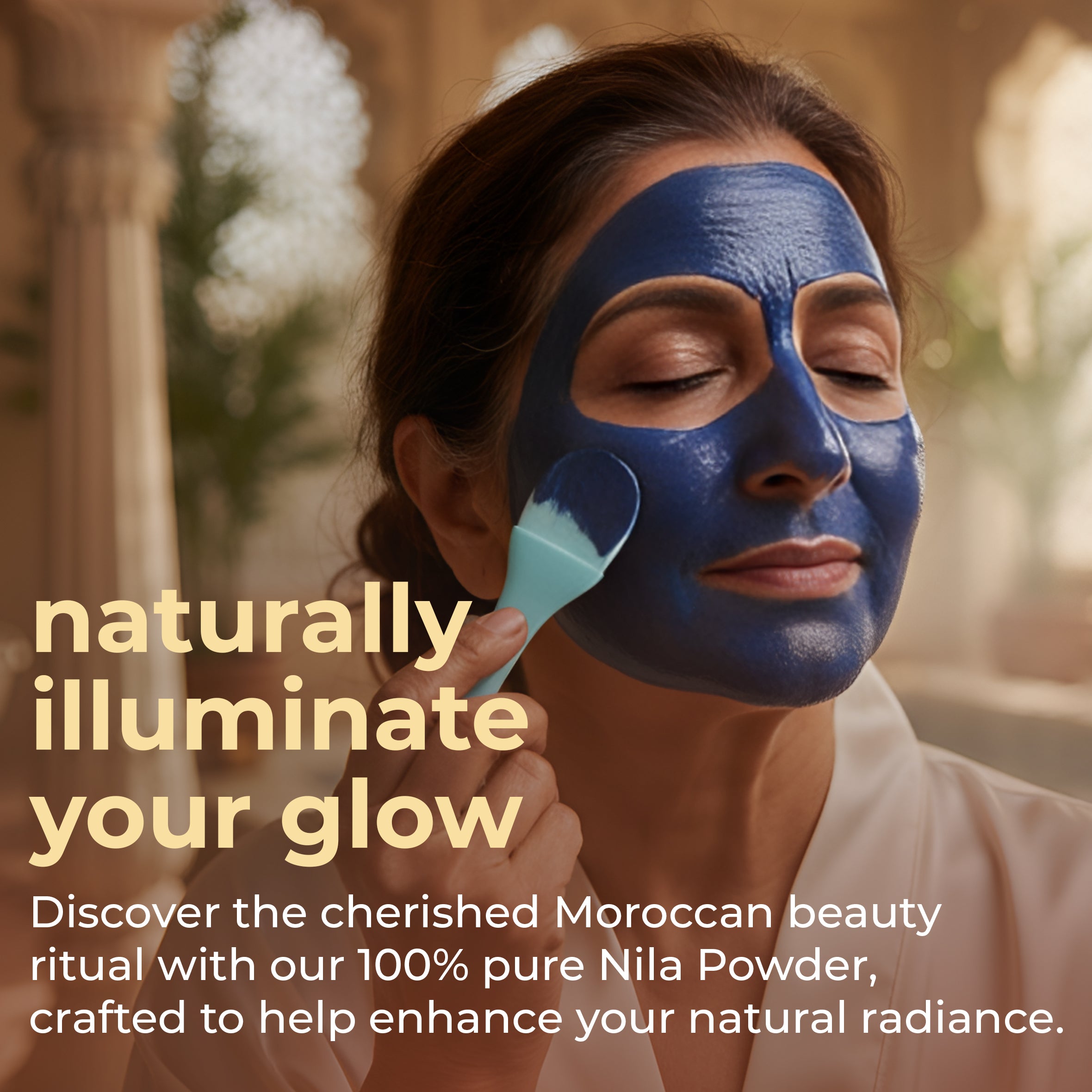 Woman applying face mask with natural indigo powder for hair, promoting radiant skin and beauty rituals