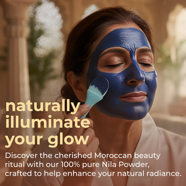 Woman applying face mask with natural indigo powder for hair, promoting radiant skin and beauty rituals