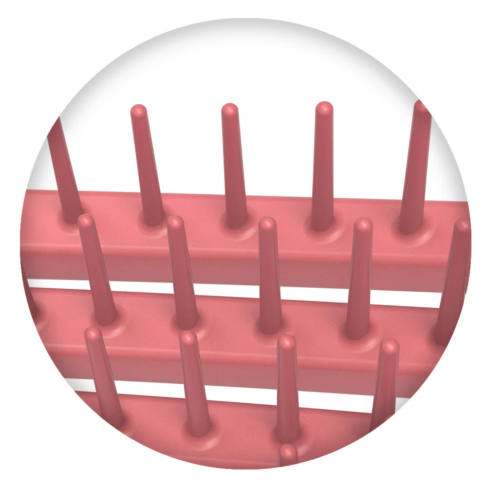 Close-up of pink bristles on Olivia Garden curly hair brush showing flexible design for detangling curls