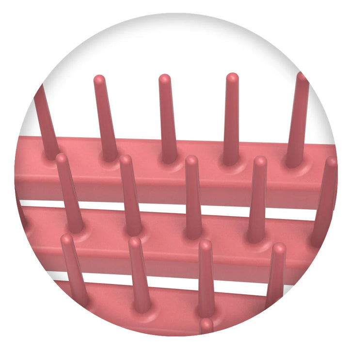 Close-up of pink bristles on Olivia Garden curly hair brush showing flexible design for detangling curls